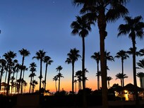 Walk out by pools towards beach near sunrise