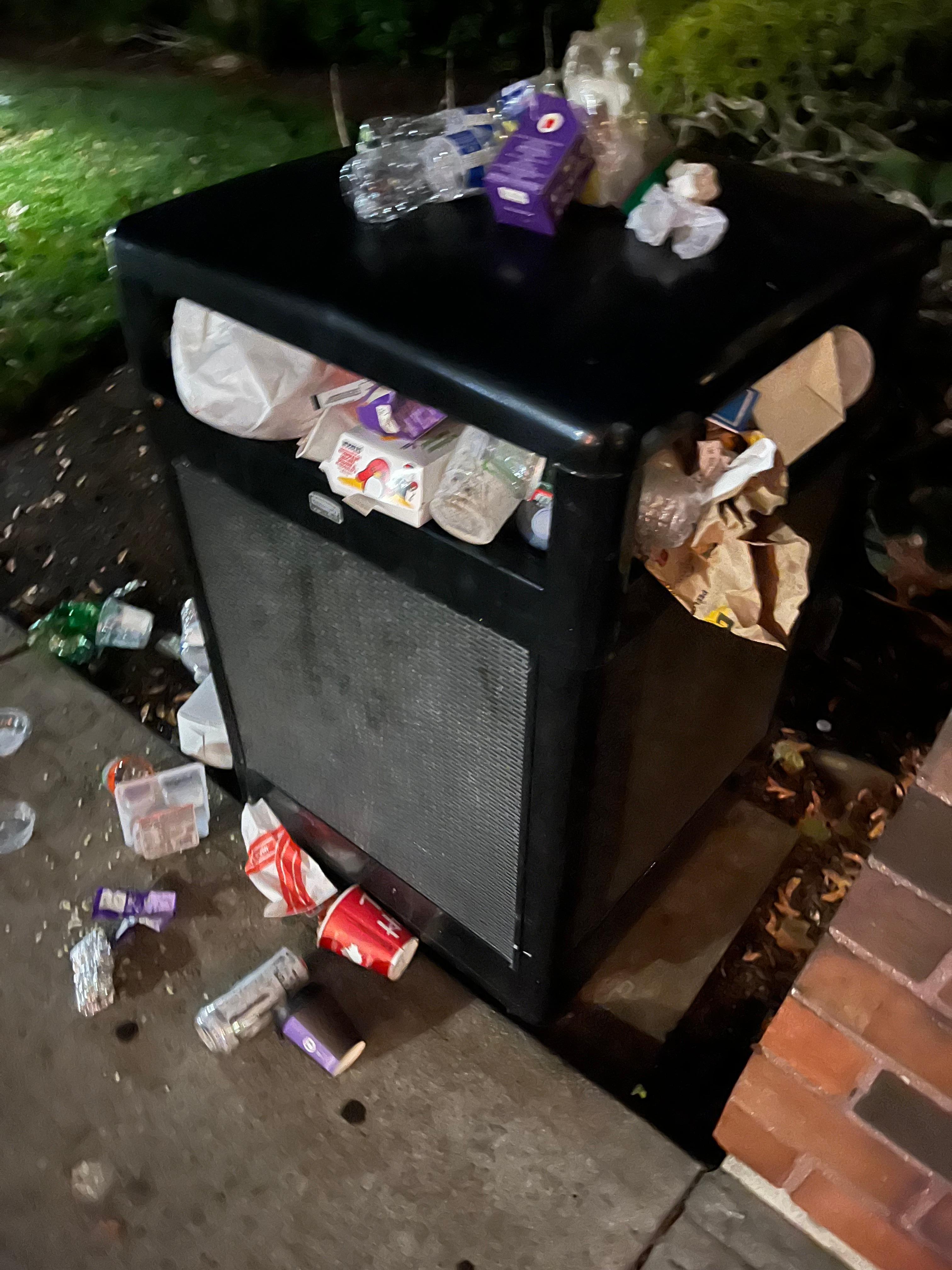 Trash at front door of hotel at 6am