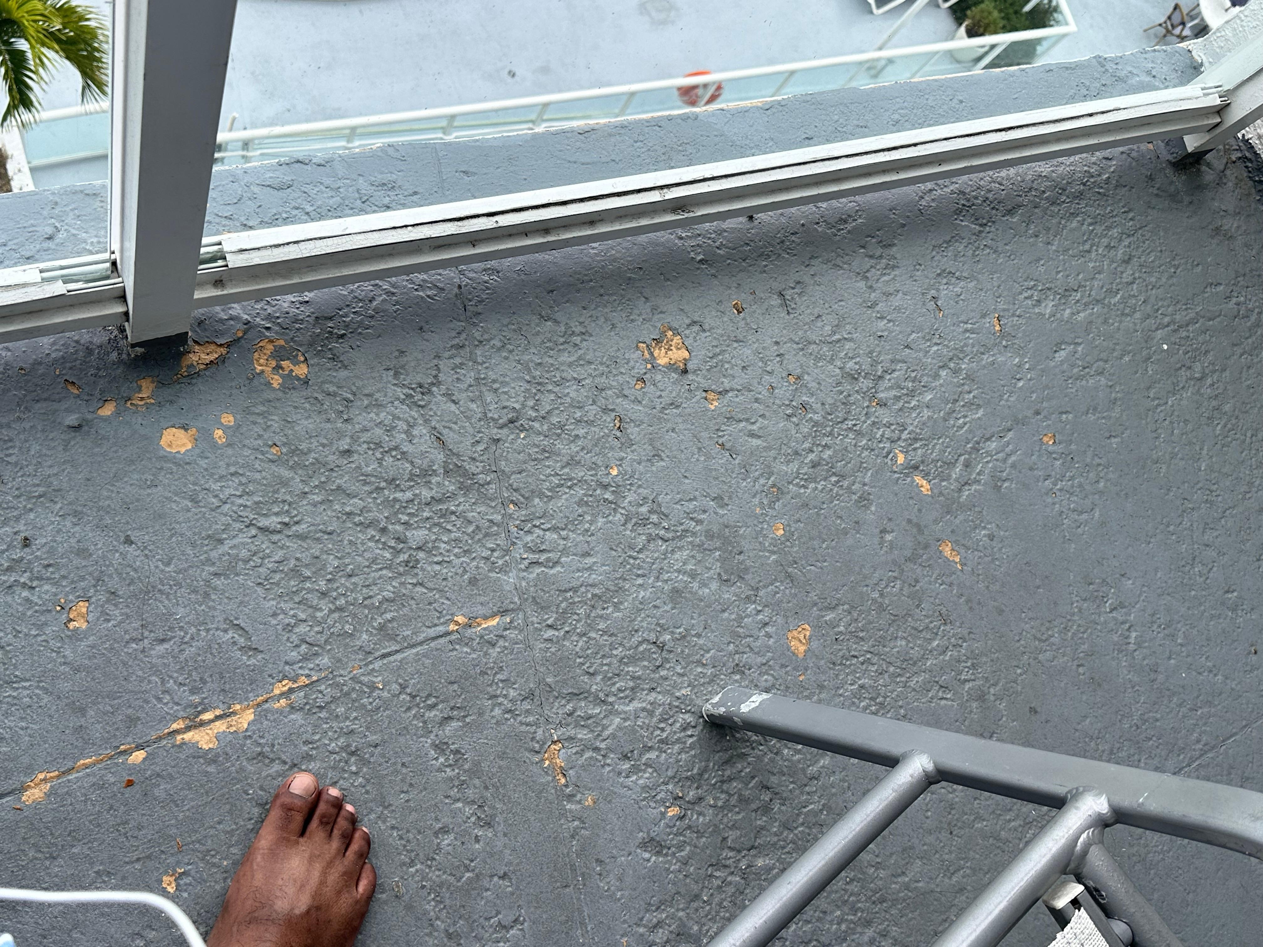 Paint peeling off from the balcony floor
