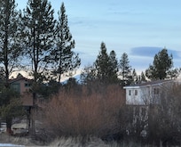 View of house from street. Also visible is a tree house that Russel was staying in a couple days during our two week visit. Russell is very friendly and was helpful for giving recommendations or answering any questions we had during our stay.