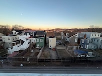 From top floor, front of house. Cemetery near by.