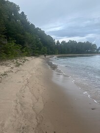 Beach in front of cabin.