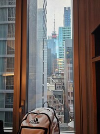 The woman at front desk with black curly hair, her name was Alyssa.. she deserves a raise