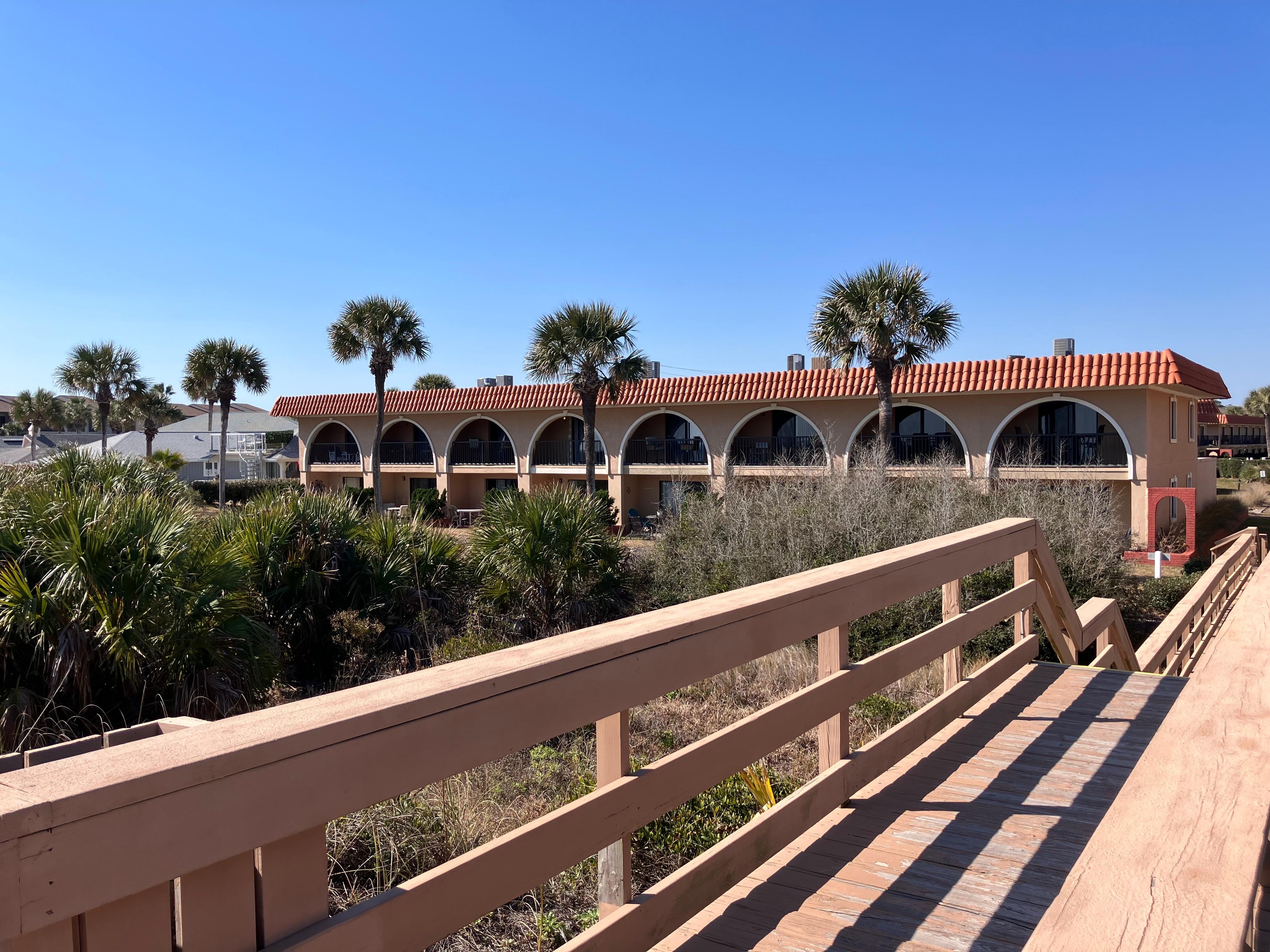 View from beach walkway. Unit is the first in the left of walkway. 