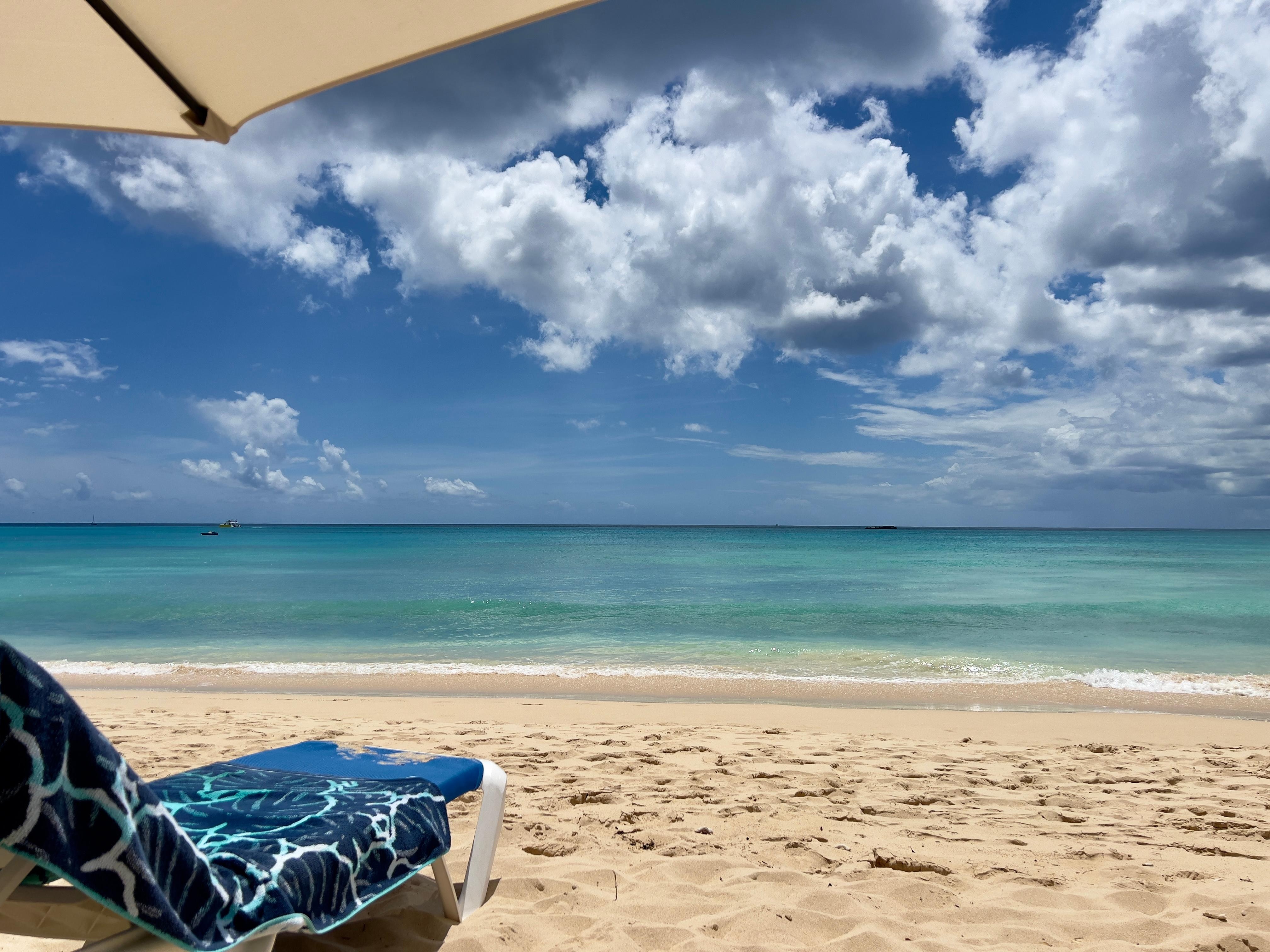 Sun loungers and umbrellas provided on the beach. 