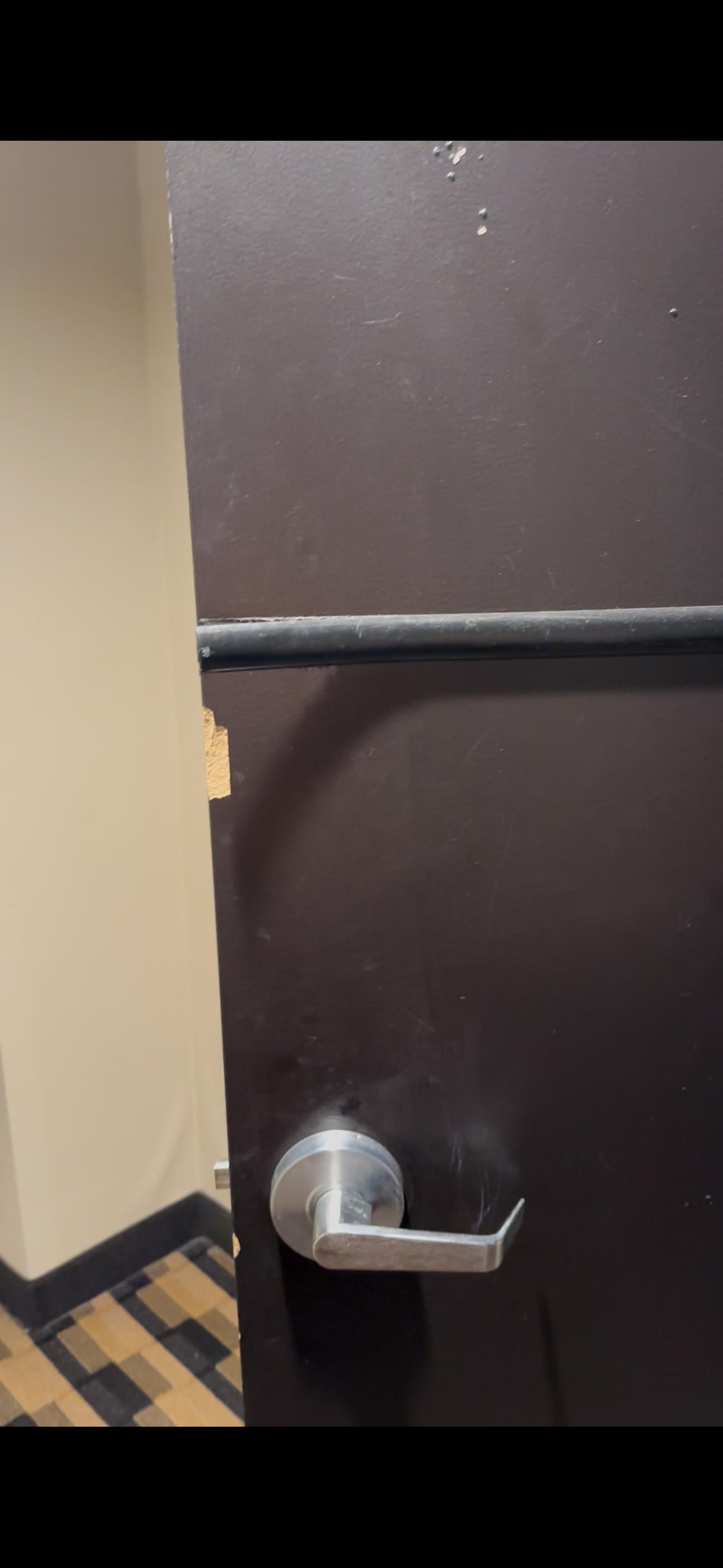Bathroom door scratched and wood was coming off. 