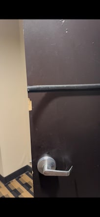 Bathroom door scratched and wood was coming off.