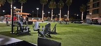The court yard ( at night) is big and very well kept . Therer are fee outdoor ping pong, pool tables and out door lounge furniture.