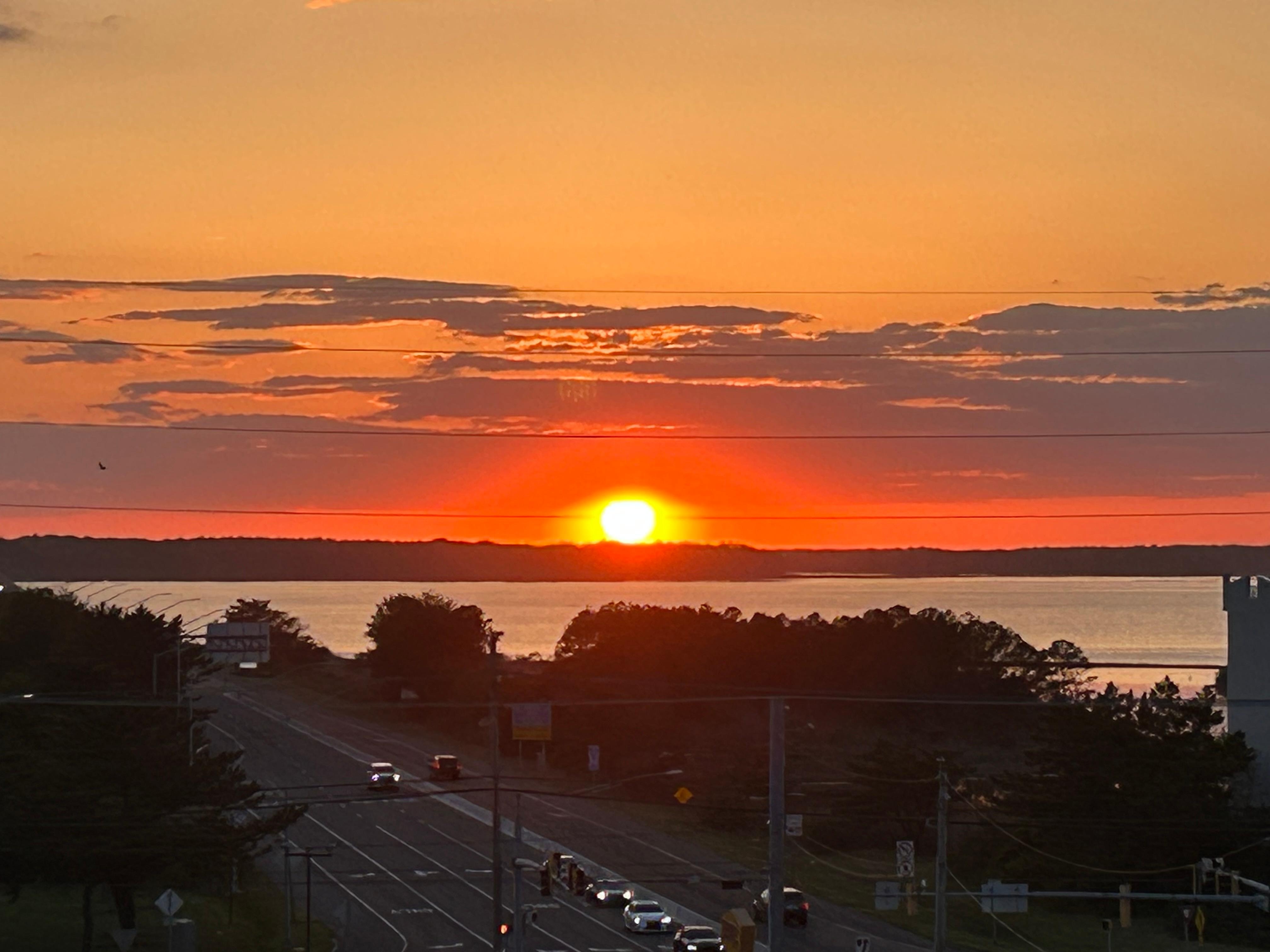 Sunset over bay as seen from back of rental condo