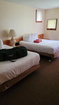 Two Full beds in one room with lots of space.
