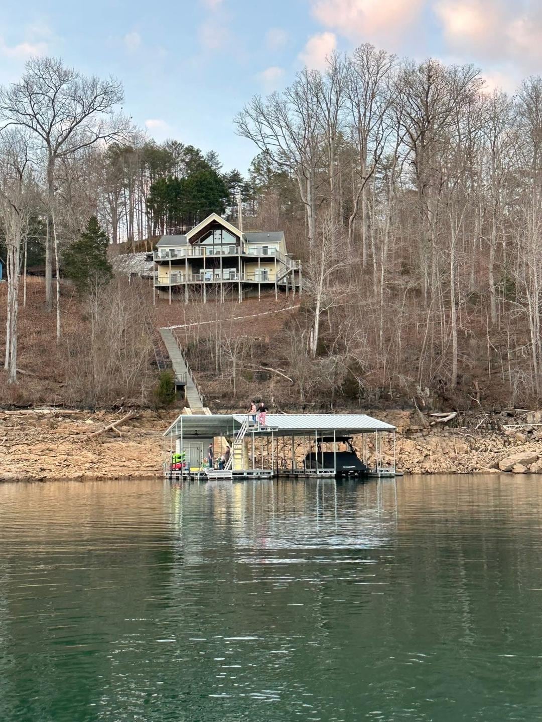 View of dock and lake house.