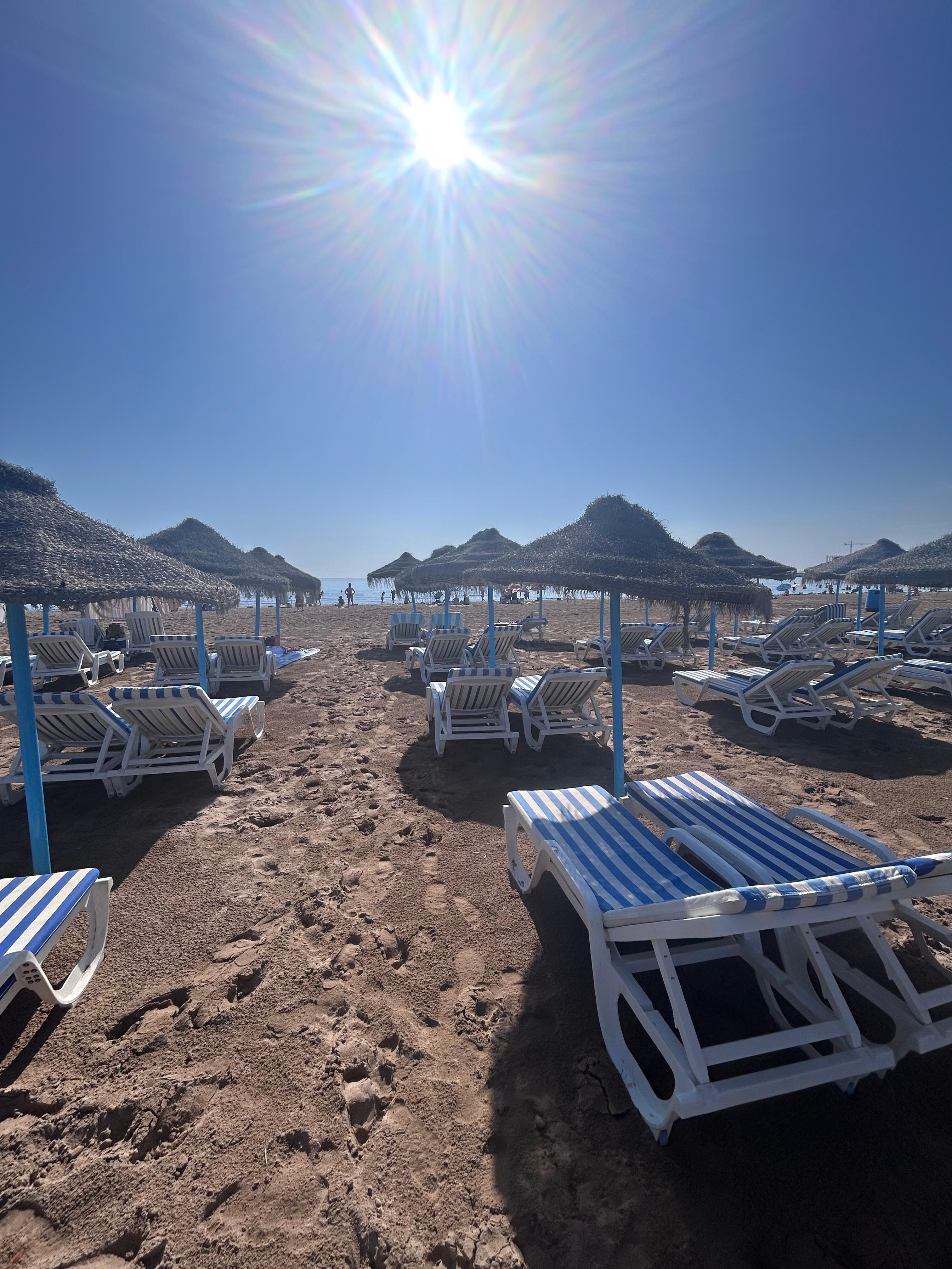 Relaxing on the beach. Umbrellas and chairs available from a local vendor for a fair price.