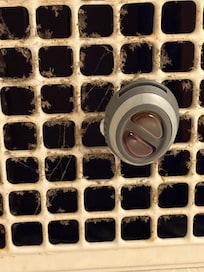 Filthy heat fan in bathroom