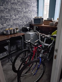 Inconsiderate guests using the kitchen area for bike storage.