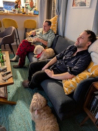 Sofa. Enjoying the game. Lilly decided that she liked being between the two guys