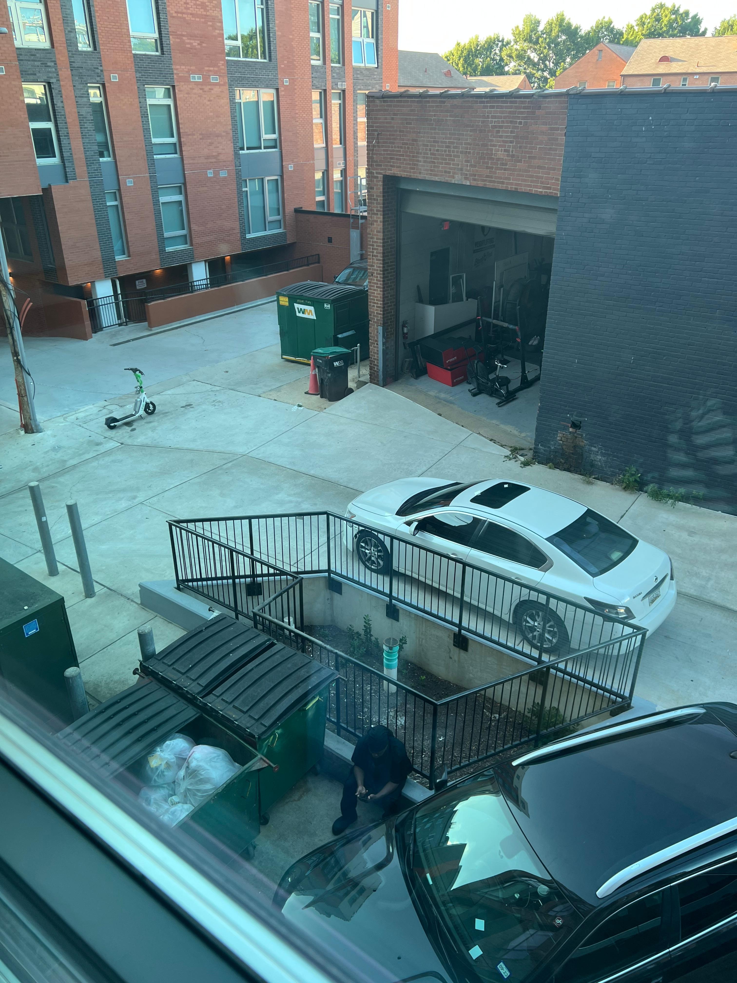 
So-called city view where you could see a worker sitting there having a cigarette break.