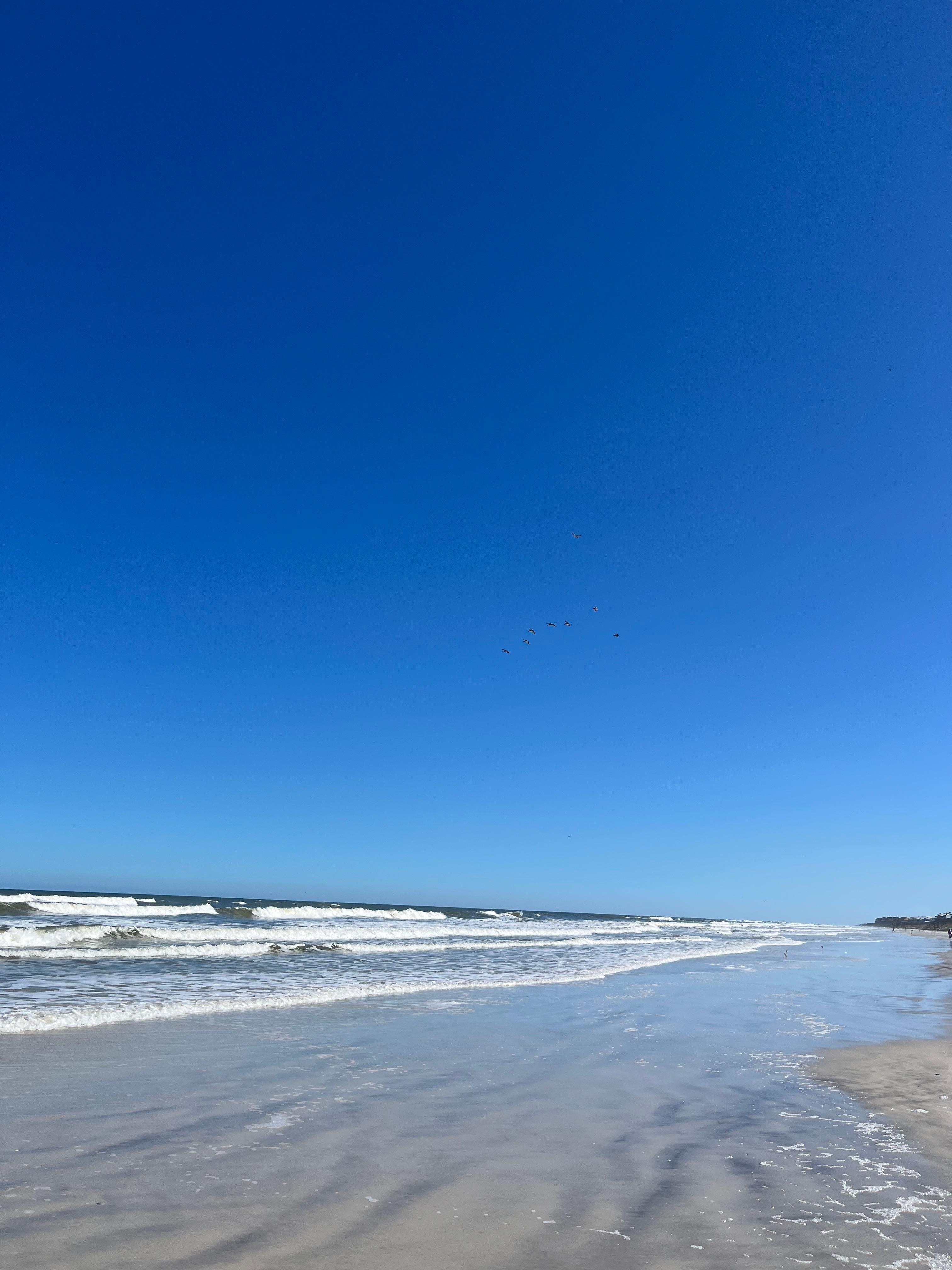 Clean and empty beach right outside the condo property. 