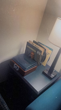 Record player with records in room