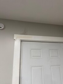 Dirt/Cobwebs located above main entrance.