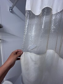 Hole in shower curtain?!?! How do you miss this?