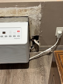 The wall next to the heater/air conditioner