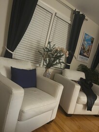 Partial living room which also has great sofa , large tv, WiFi and electric fireplace. Plenty of closet space great walk in showers