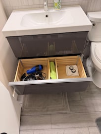 Two nice drawers with hair dryers, soap, lotion.