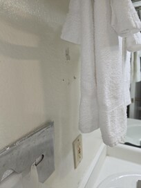 Cheap towels hard to the touch. Cracked walls.