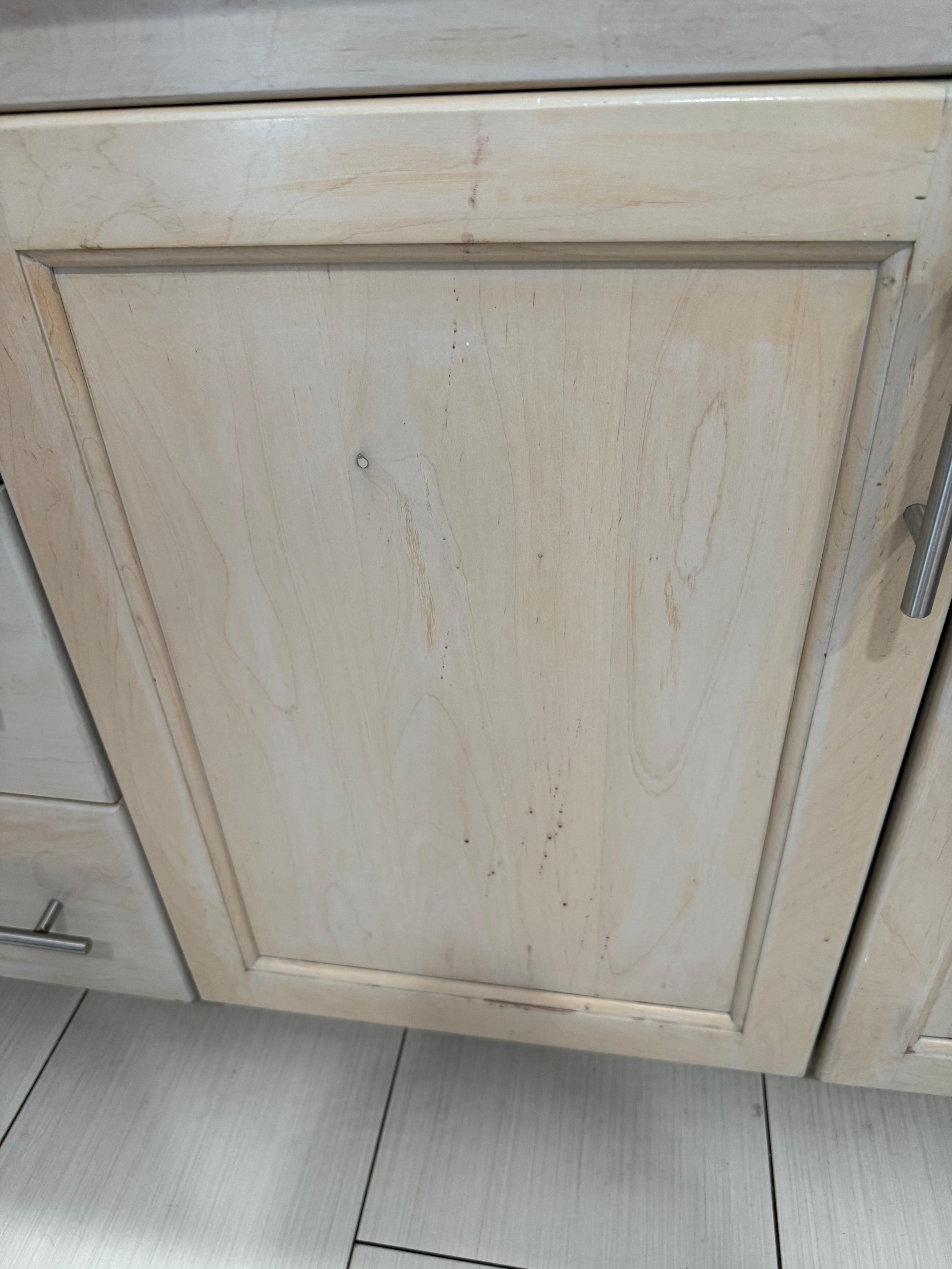 Front of cabinets sticky brown stains