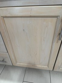 Front of cabinets sticky brown stains