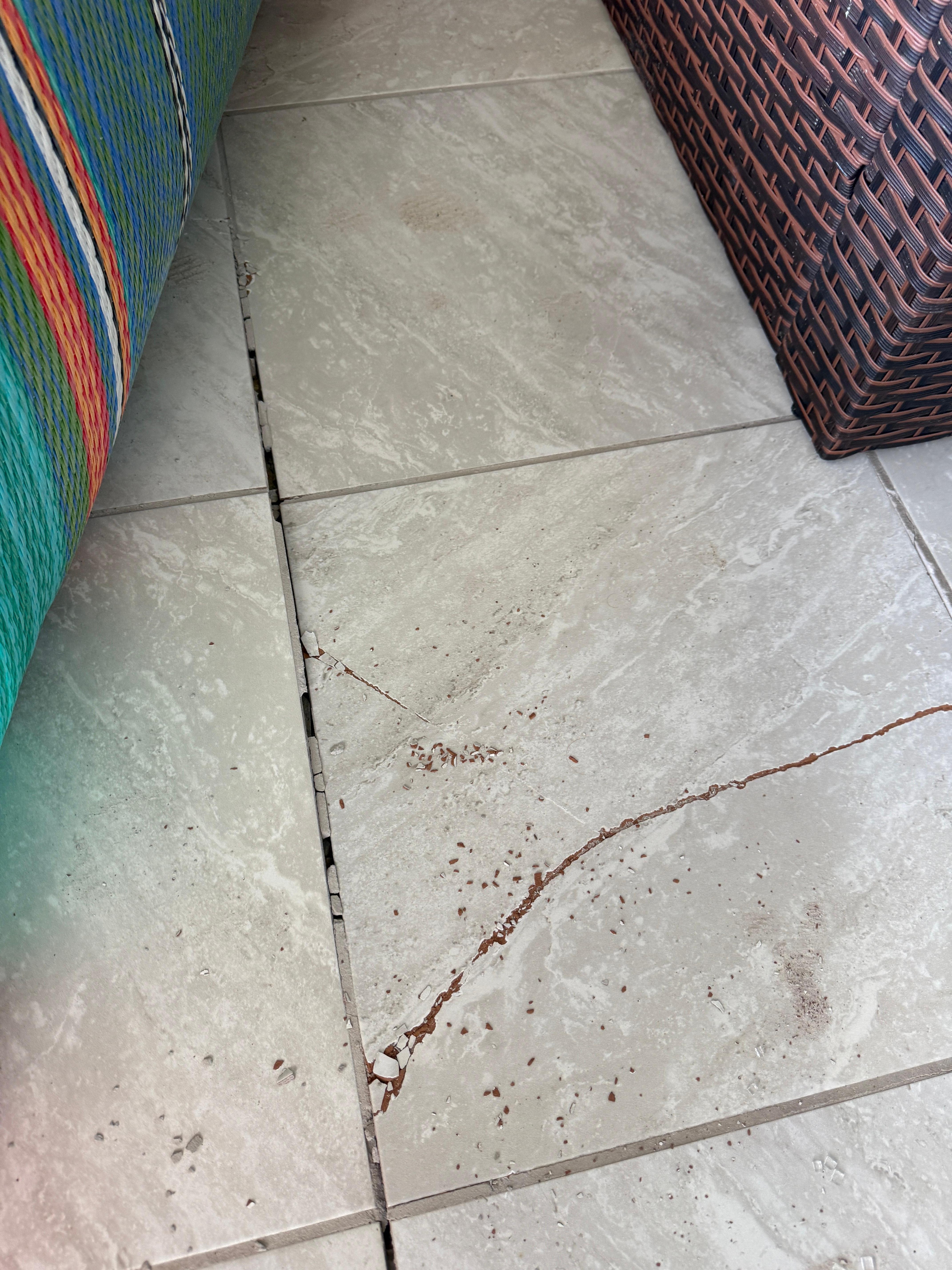 Cracked tile on the enclosed porch