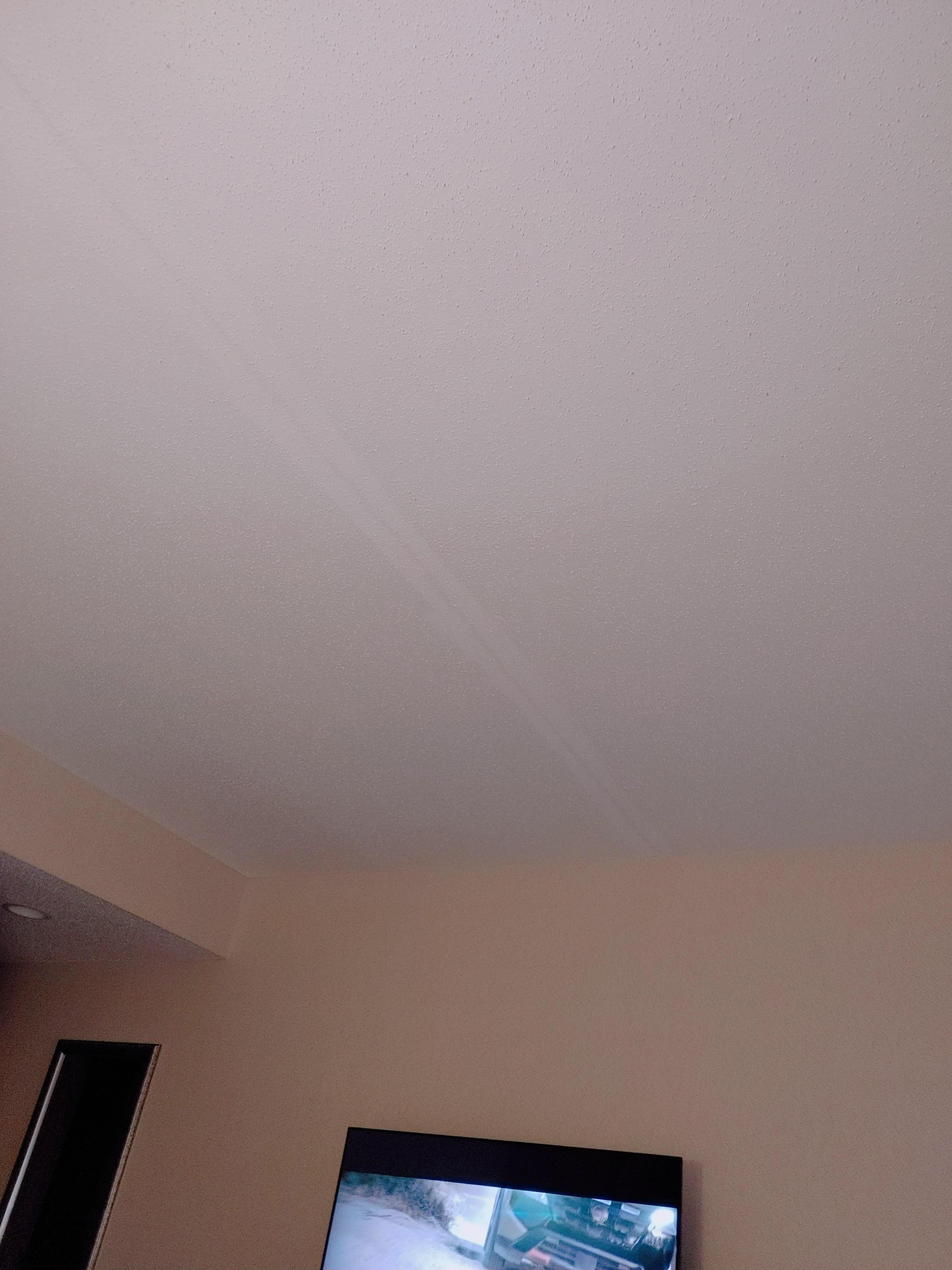 One of two long cracks in bedroom ceiling