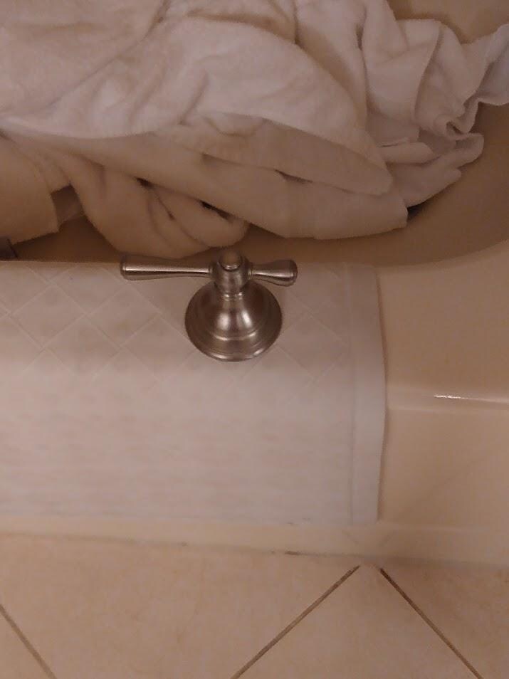 Shower knob on tub where we put it in plain site to have repaired