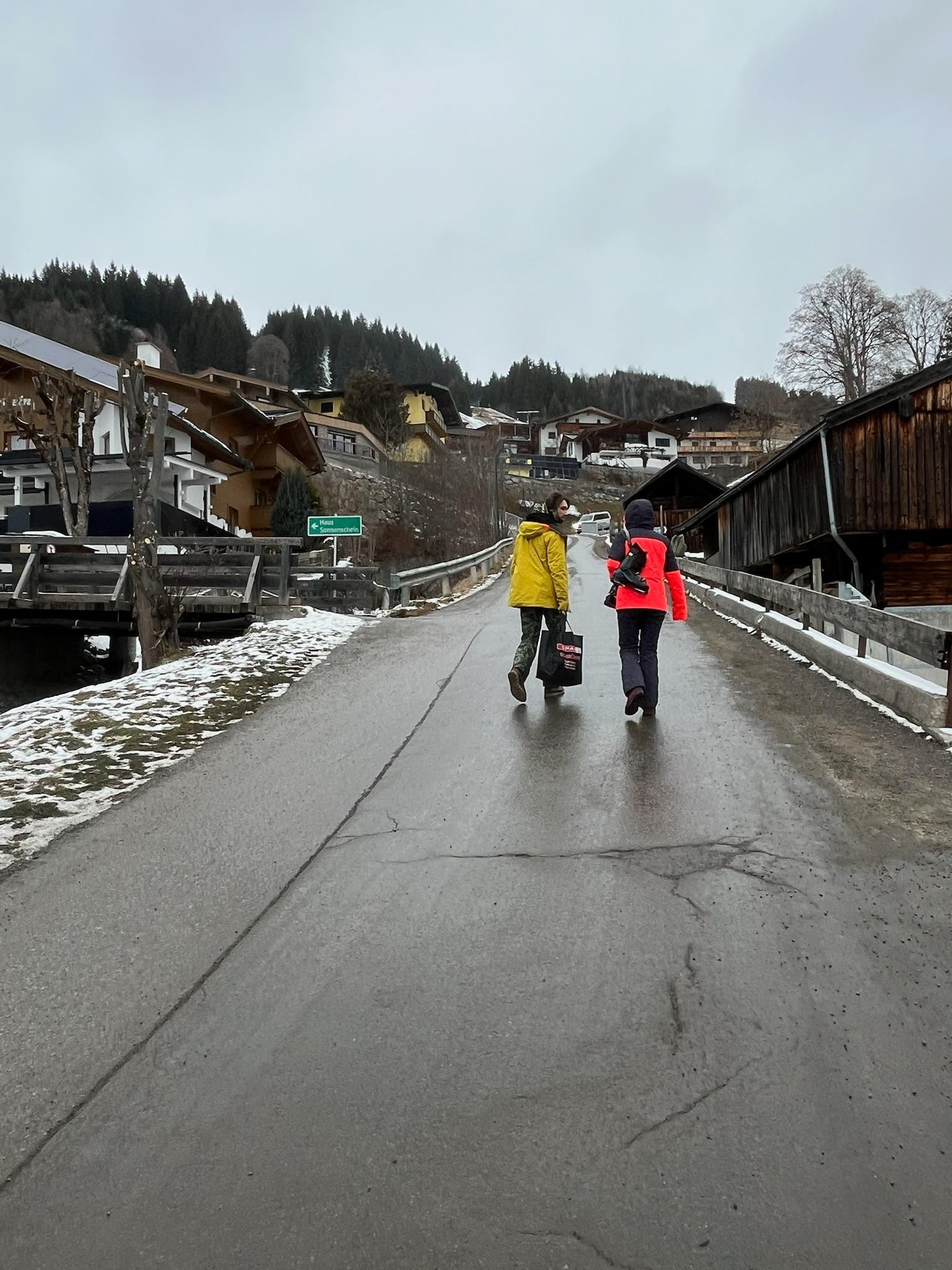 Walking up hill toward house.
