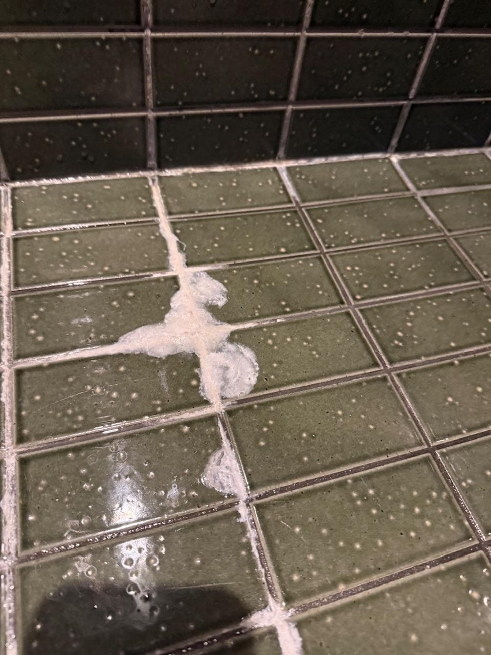 Shower floor buildup
