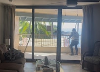 Construction worker on my balcony/lanai working in the morning.