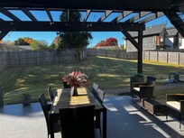 Patio table for outdoor dining (still
possible in late Oct) and nice backyard for kids to play — hill would be awesome for sledding for the rare snowstorms
