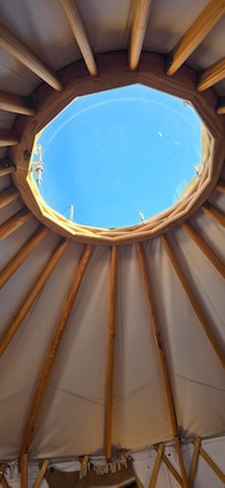 You can see the night sky from your bed.