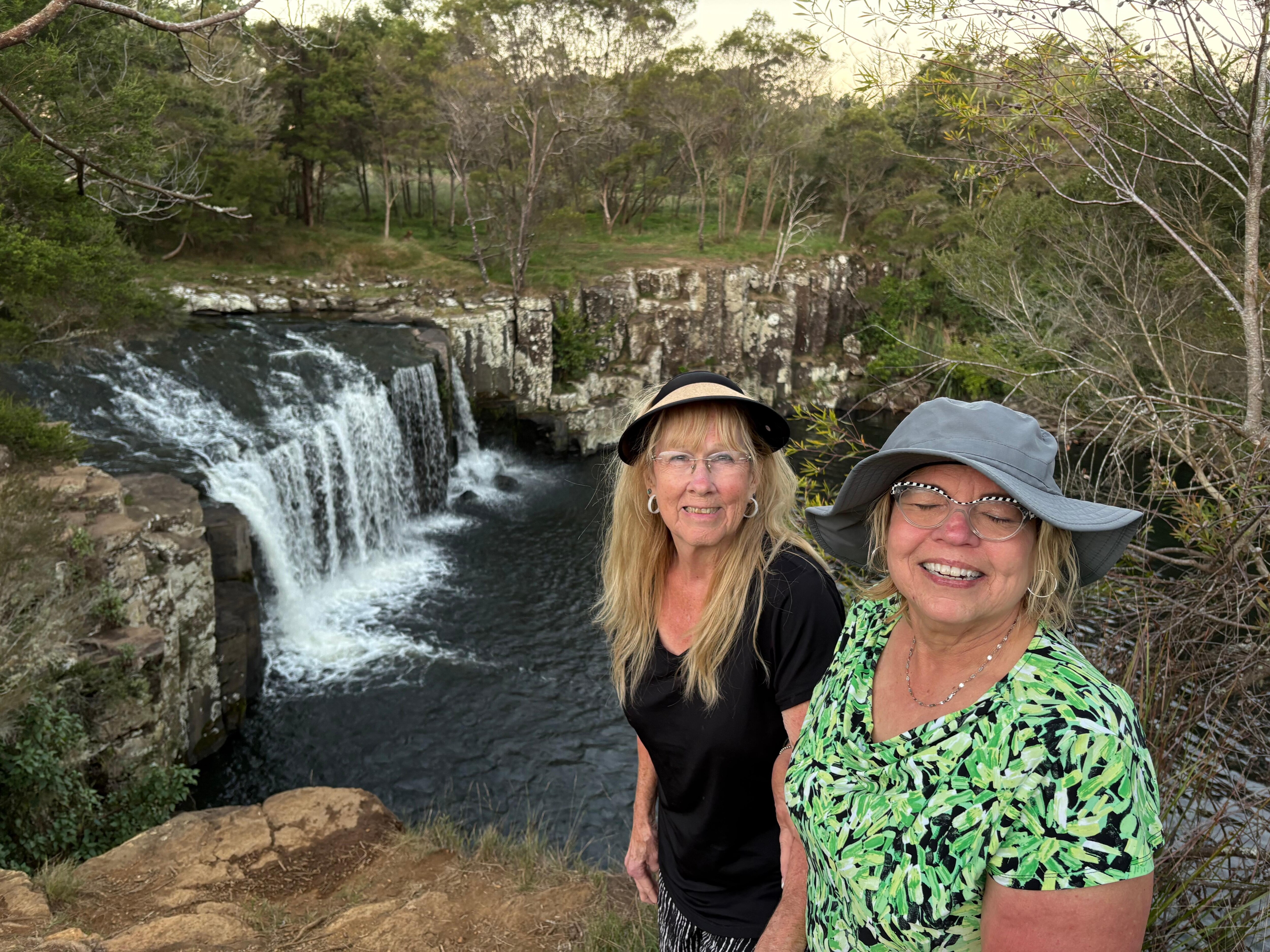 By the prettiest waterfall I’ve ever saw. Right in the back yard