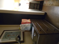 Old cheap furniture that looks like someone picked it up at a yard sale. Definitely not giving any sort of new mexican vibes or aesthetic value