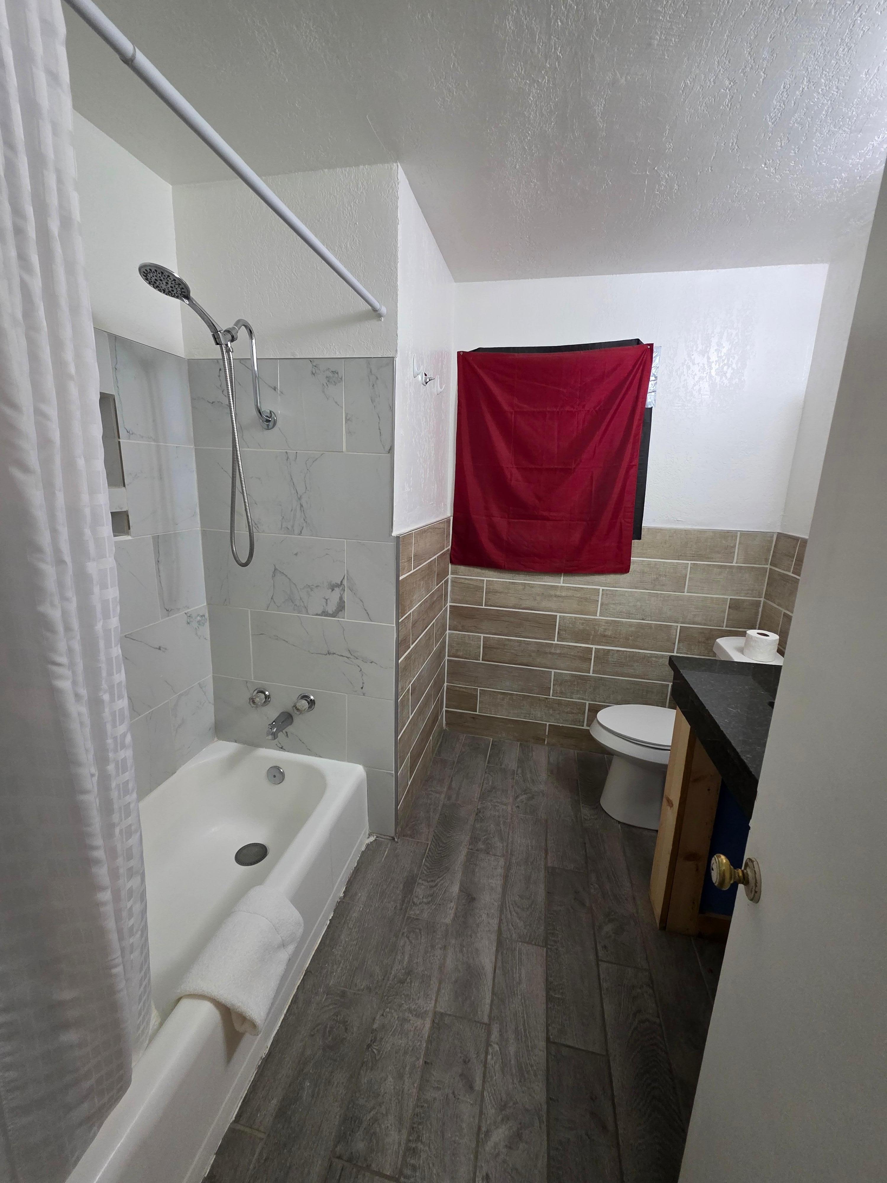 Bathroom, shower is a bit small, but no moreso than the big chains. The shower wand is great, no spinning around to rinse off. 