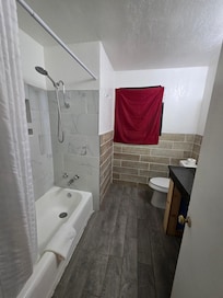 Bathroom, shower is a bit small, but no moreso than the big chains. The shower wand is great, no spinning around to rinse off.