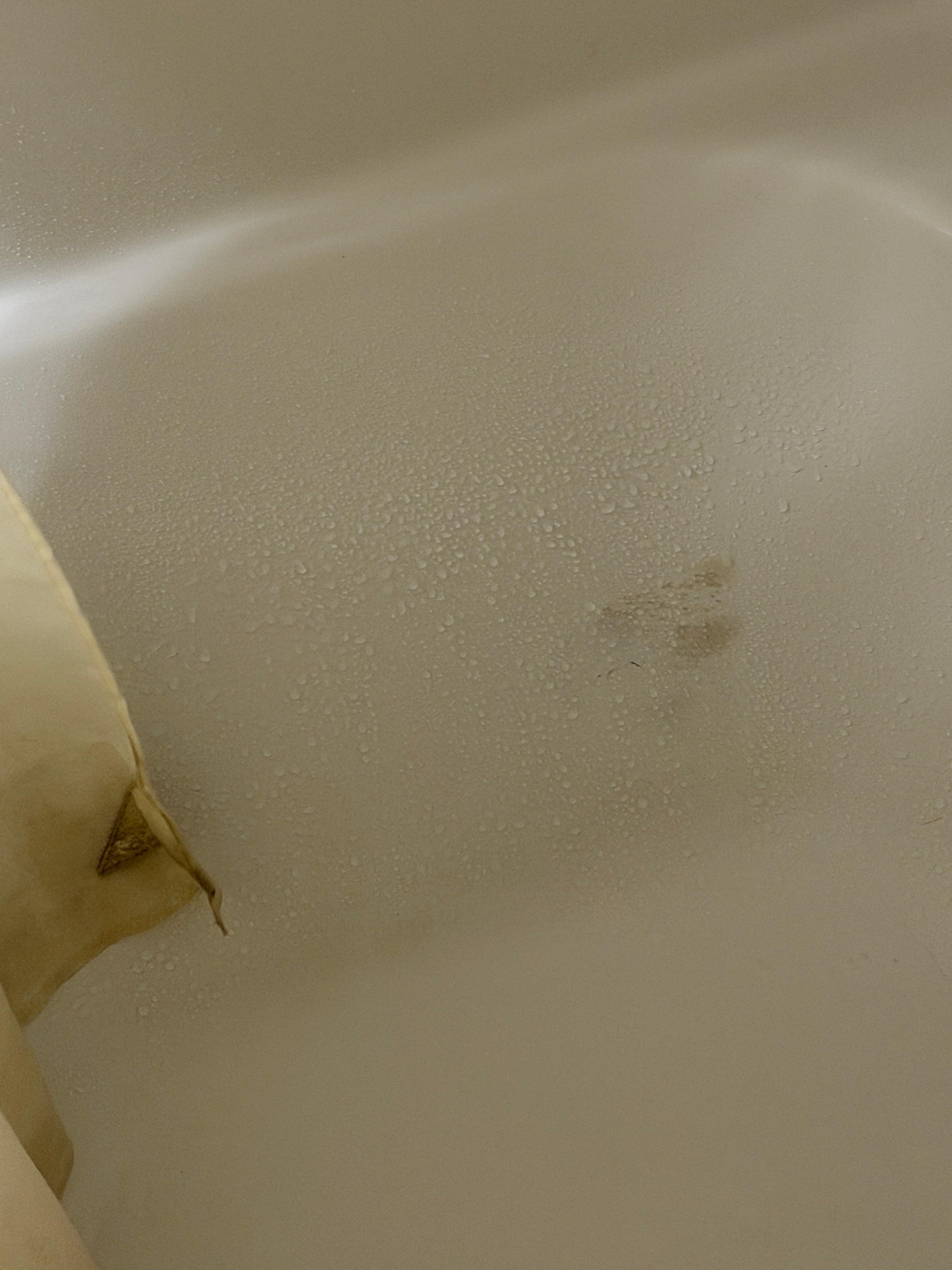Stains on bathtub and shower curtain 