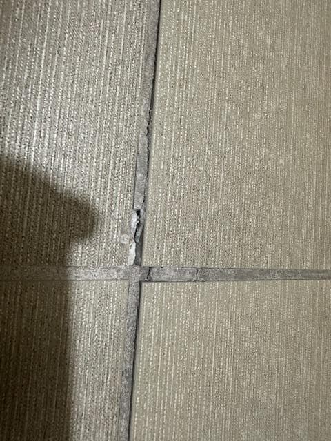 Bathroom grout popping out