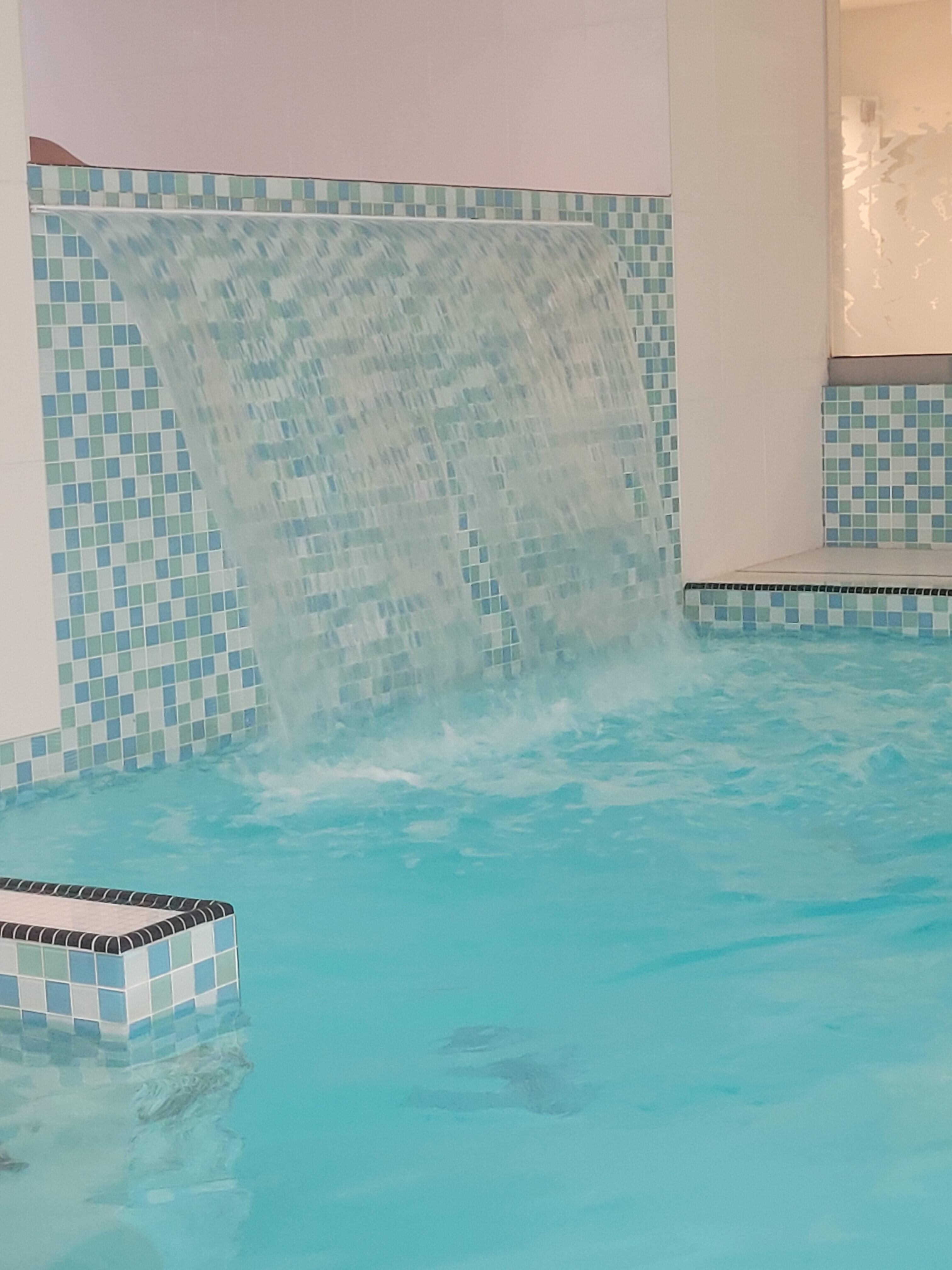 The pool at the hotel also has a waterfall feature. Up behind the waterfall is the hot tub.
