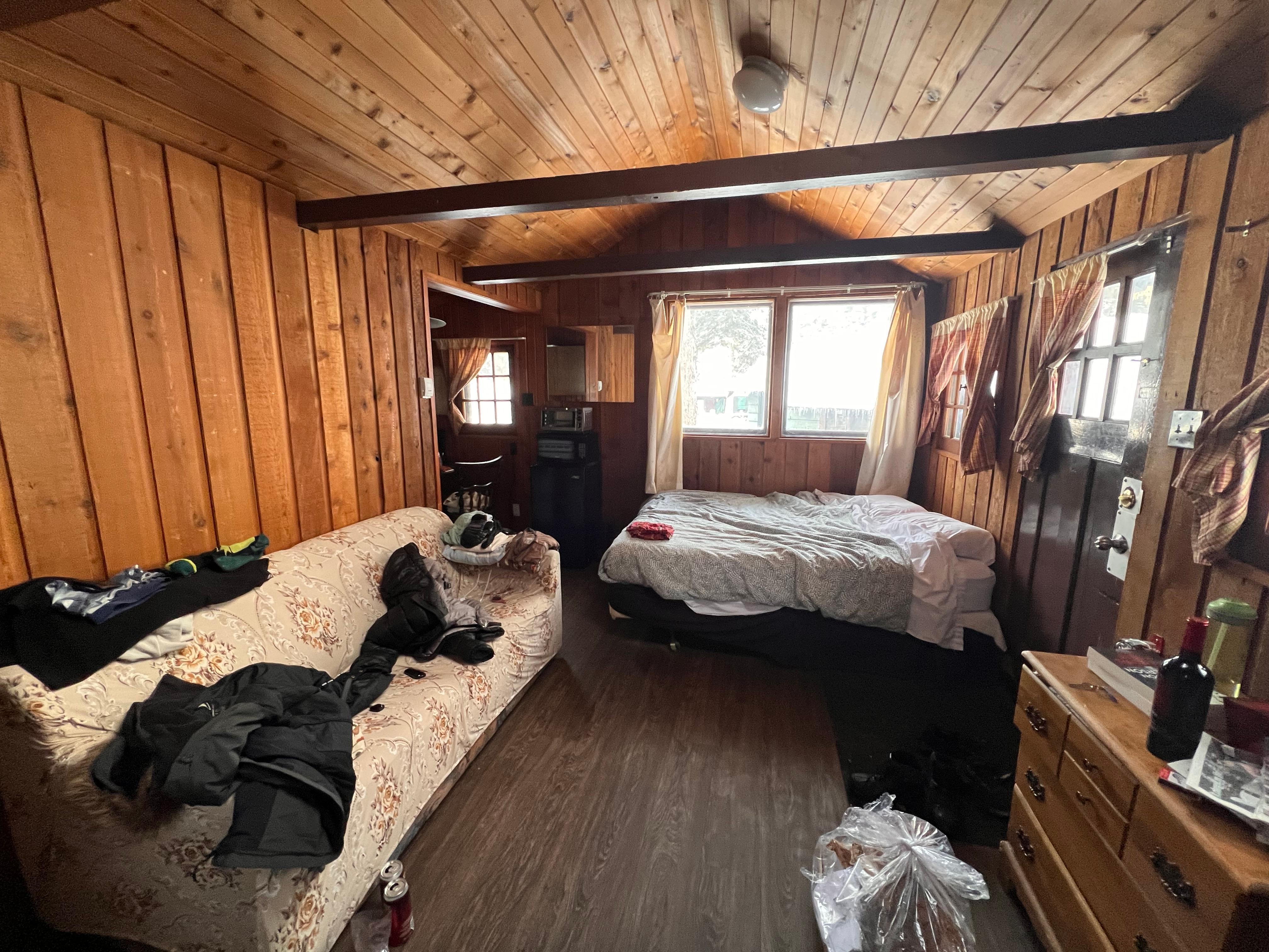 Main area, kitchen is to the left of the bed