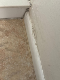 Baseboard near the shower