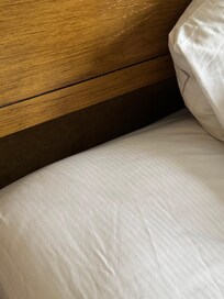 The space between the mattress and the headboard.