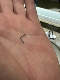 metal staple stuck in my foot hiding in rug by bed