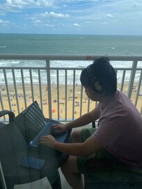 My son in the balcony. You can see the beach..